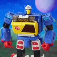 A close-up of the Twin-Cast figure in its robot mode, showing its torso's cassette deck and a clear plastic chest piece