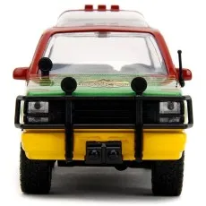 A head-on, front view of a Jurassic Park toy car with its bumper and headlights visible
