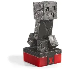 A detailed close-up shot of the black rook chess piece from the Minecraft set, which is a blocky, black monster-like figure