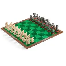 A chess set with Minecraft-themed pieces, with white and black pieces on a green and black board