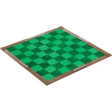 A top-down view of the Minecraft chess board, with its green and black checkered pattern and a wooden frame