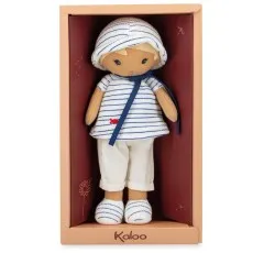 A soft-bodied doll in a white and blue sailor outfit inside a branded gift box.