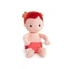A baby doll with orange hair, wearing a diaper-like bottom with a small animal print on it