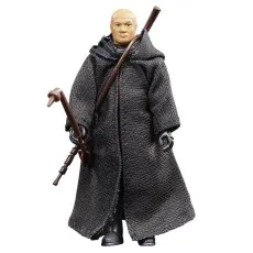 The Star Wars action figure of Boba Fett from the Dune Sea, wearing a black cloak and holding a staff.