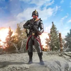 A full-body, posed shot of the Cobra Iron Grenadier figure standing on a hill in a battlefield diorama