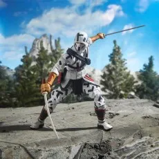 A close-up of a Storm Shadow action figure in a fighting stance with two swords