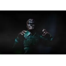 A close-up of the Wolfman action figure, with glowing eyes and claws extended.