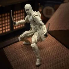A white-clad Storm Shadow action figure kneeling on a tatami mat, wielding two katanas