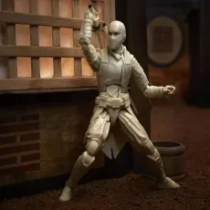 A white-clad Storm Shadow action figure posed with a katana on his back, in a diorama setting
