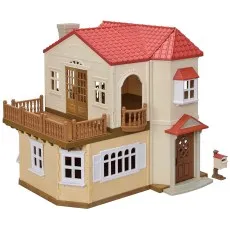 A detailed, two-story Sylvanian Families dollhouse with a red roof, balconies, and a mailbox