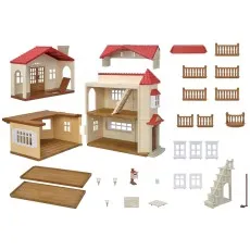 A Sylvanian Families dollhouse playset shows all the individual parts, including the walls, roof, balconies, windows, and stairs