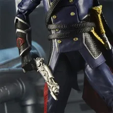 A close-up of a Cobra Commander action figure's hand holding a pistol, showing details of his uniform