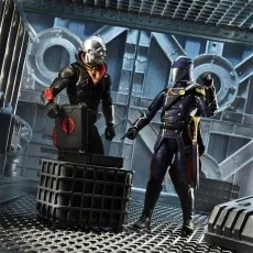 A detailed G.I. Joe Classified Series Cobra Commander figure pointing at a Baroness figure holding a briefcase