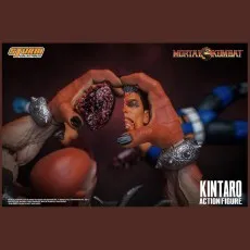 A highly detailed toy accessory showing Kintaro's hands holding a bloody, ripped-apart head