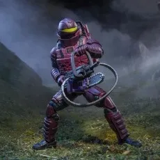 A G.I. Joe Cobra S.A.W. Viper figure, wearing a helmet, is holding a chainsaw gun