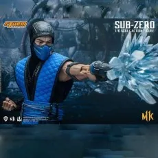 A Sub-Zero collectible figure, a male ninja, in a blue suit, performing an ice attack.