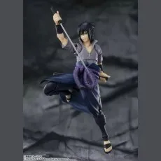 An S.H. Figuarts Sasuke Uchiha action figure in a dynamic pose, holding a katana sword.