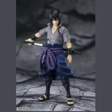 The Sasuke Uchiha action figure in a gray shirt, holding a katana sword.