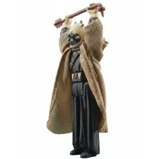 A Tusken Warrior action figure holding a Gaffi stick overhead..