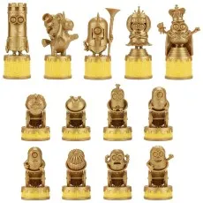 A close-up of the gold-colored chess pieces from the set, each styled as a Minion character on a yellow base