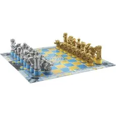 A full chess set with silver and gold steampunk-themed pieces on a blue and yellow checkered board