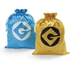 Two shiny satin Minions storage bags, one blue with a white Gru logo and one gold with a black Gru logo