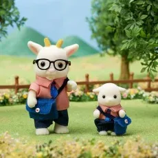 The father and son from the Sylvanian Families Goat Family set standing on a grassy field.