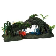 A toy diorama of a jungle scene from Avatar, featuring a giant tree root archway and plants.