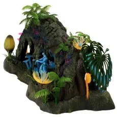 An Avatar toy playset of a moss-covered jungle arch with a figure and colorful plants on a white background.