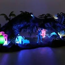 The Avatar Omatikaya Rainforest playset is illuminated, highlighting its bioluminescent features.