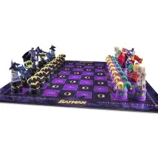 A Batman-themed chess set with black and yellow Batman pieces and colorful Joker pieces.