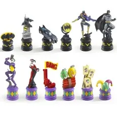 A full set of Batman and Joker chess pieces on their bases.