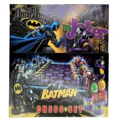 The front of a chess set box with Batman and The Joker artwork and the game pieces
