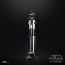 A Darth Vader lightsaber hilt on a black display stand against a dark background.