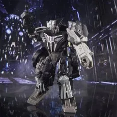 The Transformers Studio Series Barricade figure is a black and gray robot holding a blaster and posing..