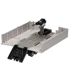 Optimus Prime's trailer accessory opened into a gray maintenance or battle base with a turret.