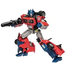 Transformers Optimus Prime (Volvo VNR) action figure in robot mode, wielding a black blaster gun.