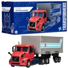 Transformers Optimus Prime (Volvo VNR) toy truck and its blue box packaging with technical schematics.