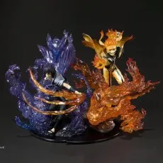 Naruto and Sasuke action figures in a dynamic battle pose, surrounded by translucent orange and purple energy effects.