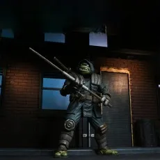 Full-body shot of The Last Ronin action figure in his dark, armored robe, standing with a katana strapped across his back