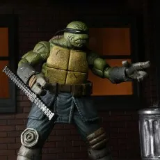 Close-up of The Last Ronin action figure holding a spiked tonfa, with his other hand extended..