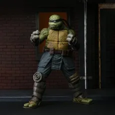 Close-up of The Last Ronin action figure in a fighting stance against a dark brick background..j