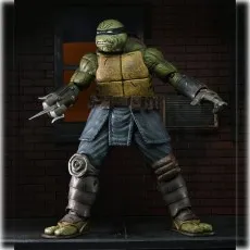 NECA's The Last Ronin action figure in an armored suit, holding a sai and standing in a dark alley.