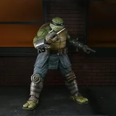 NECA's The Last Ronin action figure in an armored suit, holding two sai weapons between his fingers.