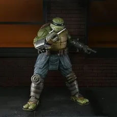 NECA's The Last Ronin action figure in an armored suit, holding two sai weapons between his fingers.