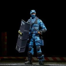 G.I. Joe Classified Series Shockwave figure in blue urban camo, holding a riot shield and baton, standing in darkness.