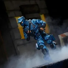 G.I. Joe Classified Series Shockwave figure in blue urban camo, running dynamically through a smoky alleyway.