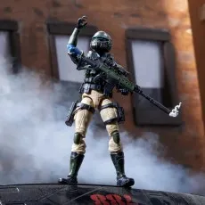 G.I. Joe Steel Corps Trooper figure standing on a surface with a rifle, raising one arm in an action pose in smoke.
