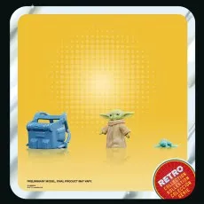 Star Wars Grogu toy set, showing the figure and two accessories on a vintage-style backdrop