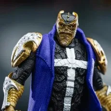 Close-up of the Spawn Disruptor action figure's head and torso in gold, black, and blue armor.